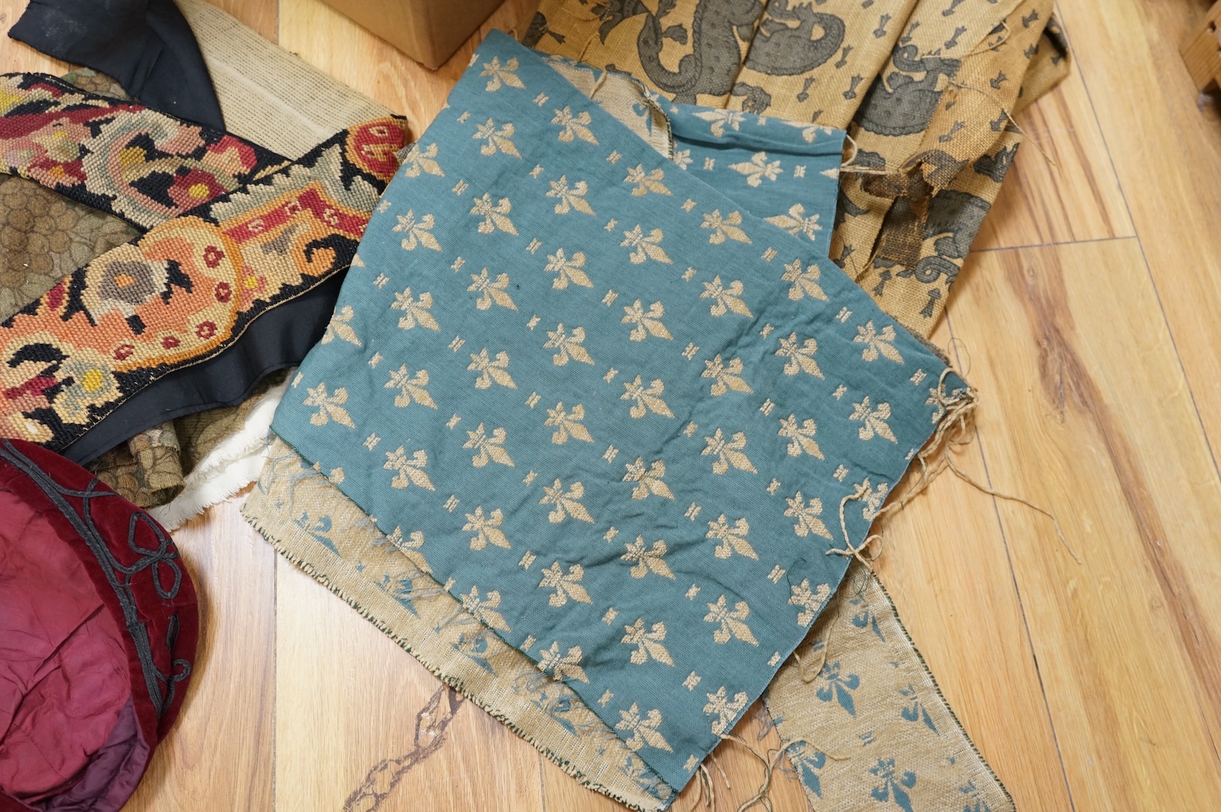 A 19th century beadwork panel and bell pull, various samples of printed textiles, a collection of corded and tasselled tie backs, etc.